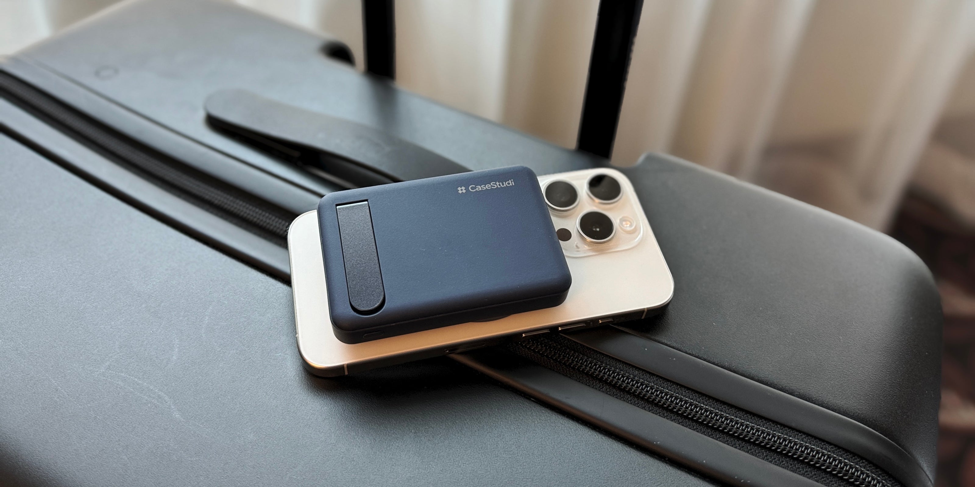 A 8000mAh compact power bank with an integrated stand for convenience and portability.