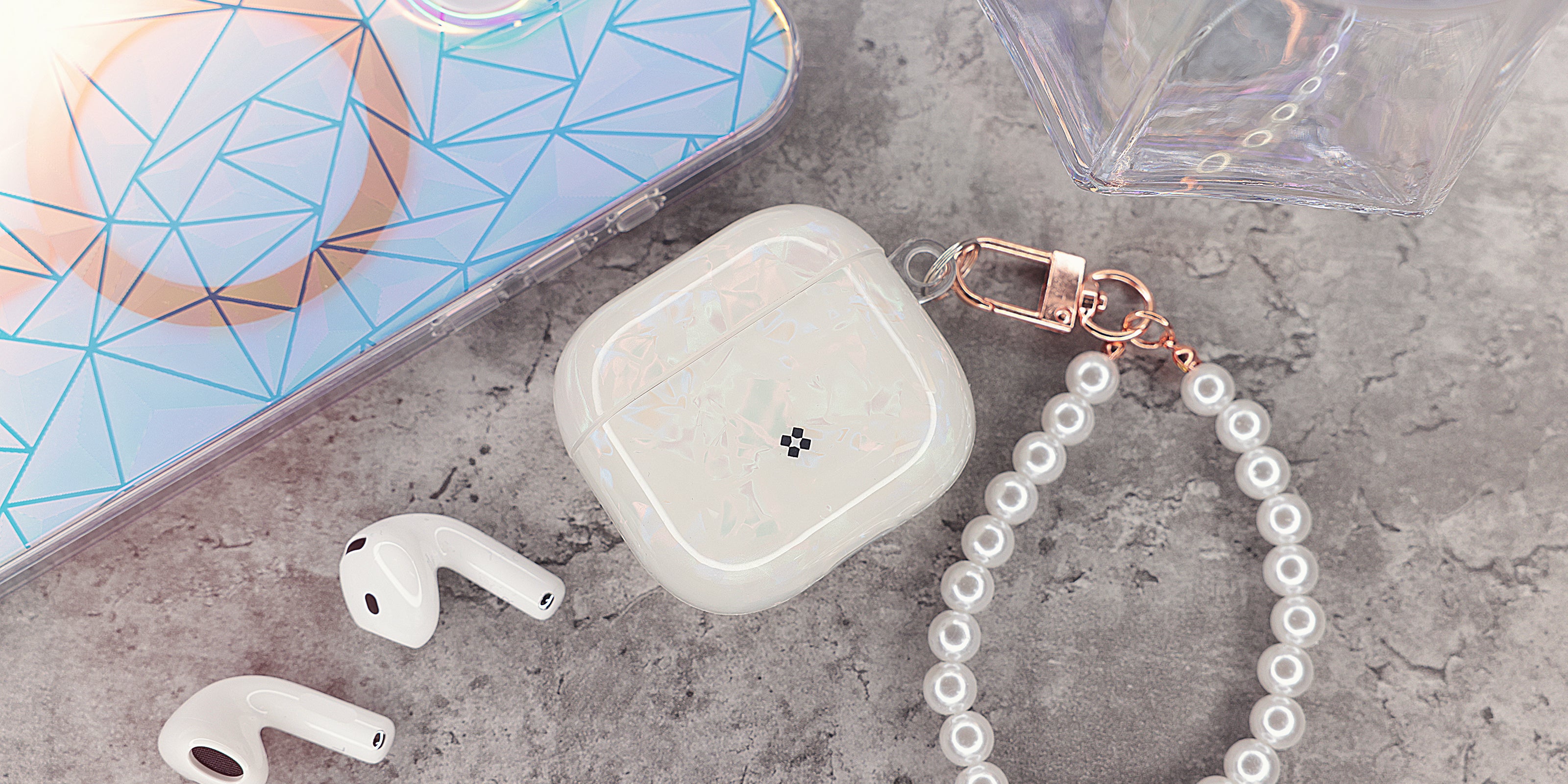 The Gala AirPods 4 Case offers a sleek, elegant design with an IMD shell pattern for a unique look and anti-scratch protection to keep it flawless. Its durable PU construction ensures reliable defense, while the two-piece snap-on design allows easy installation. Complete with an acrylic pearl strap for charm and portability, it supports both cable and wireless charging, blending practicality with style.